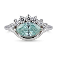 Ocean Bloom marquise cut aqua blue moissanite crown ring with round accent stones in a nature-inspired wave design