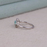 Ocean Bloom marquise cut aqua blue moissanite crown ring with round accent stones in a nature-inspired wave design