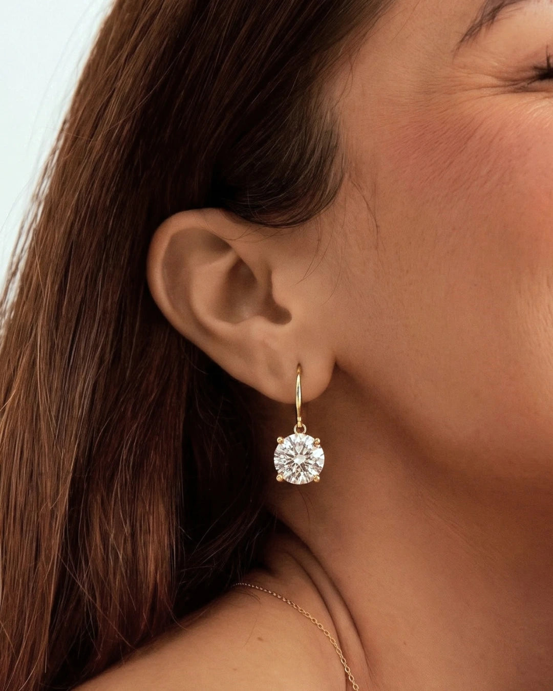 Lab-grown diamond drop earring worn on the ear