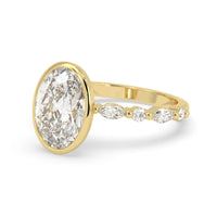 Oval bezel set lab grown diamond pave engagement ring with 3.50 carat center diamond in yellow gold