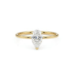 metalcolor:yellow Pear cut moissanite solitaire engagement ring with clear center stone in prong setting and minimalist band design