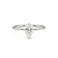 metalcolor:white Pear cut moissanite solitaire engagement ring with clear center stone in prong setting and minimalist band design
