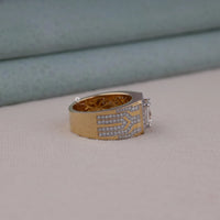 Men's princess cut Moissanite halo ring with wide geometric pavé band and statement luxury design in yellow tone metal.