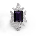 Purple baguette cut CZ statement ring with round cut accent stones and floral-inspired luxury design