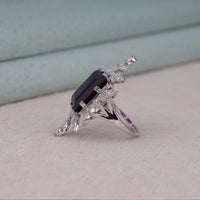 Purple baguette cut CZ statement ring with round cut accent stones and floral-inspired luxury design