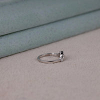 Round cut five stone moissanite curved ring with prong setting and elegant crown-inspired design
