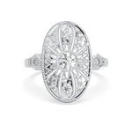 Vintage oval statement ring featuring round moissanite center stone, halo-inspired detailing, and intricate openwork luxury design
