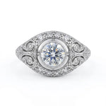 Vintage round cut moissanite bezel ring with 1.00 carat center stone, milgrain detailing, halo accents, and antique-inspired design