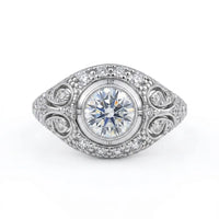Vintage round cut moissanite bezel ring with 1.00 carat center stone, milgrain detailing, halo accents, and antique-inspired design