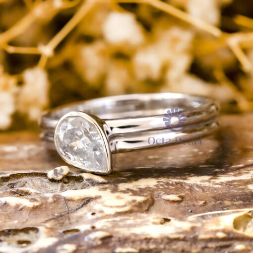 Pear Cut Moissanite Bezel Set Engagement Ring