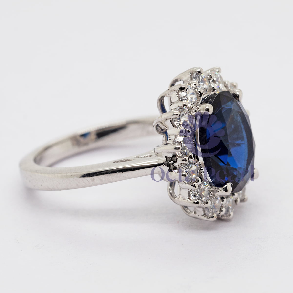 Blue Oval-Cut CZ Wedding Ring With Sunburst Halo