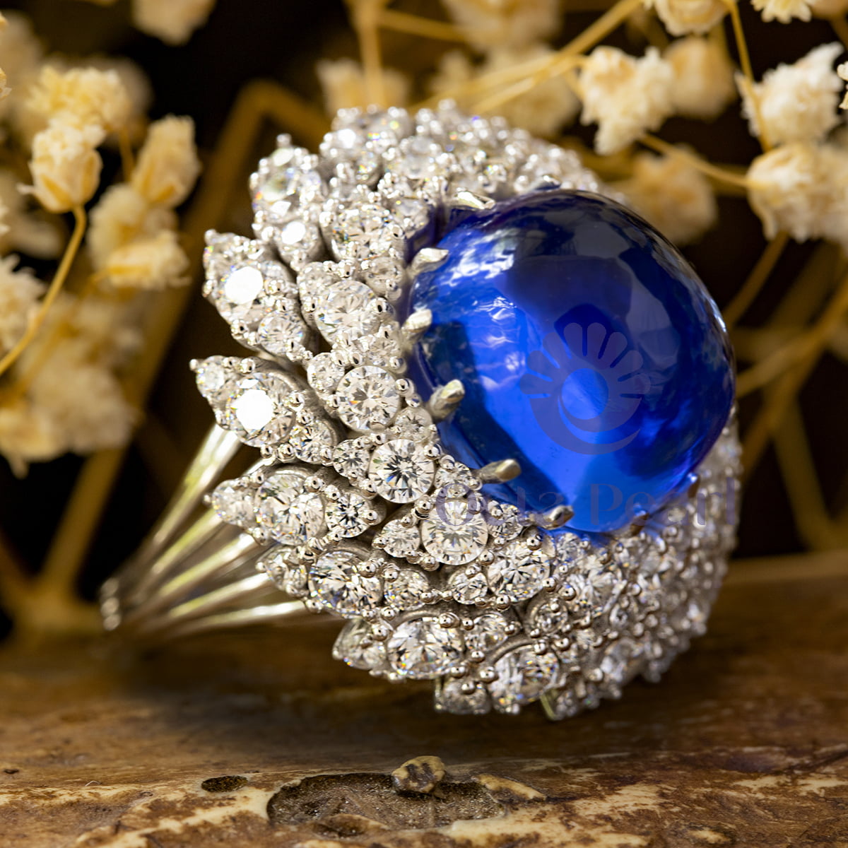 Blue Cabochon Cocktail Ring With CZ Halo