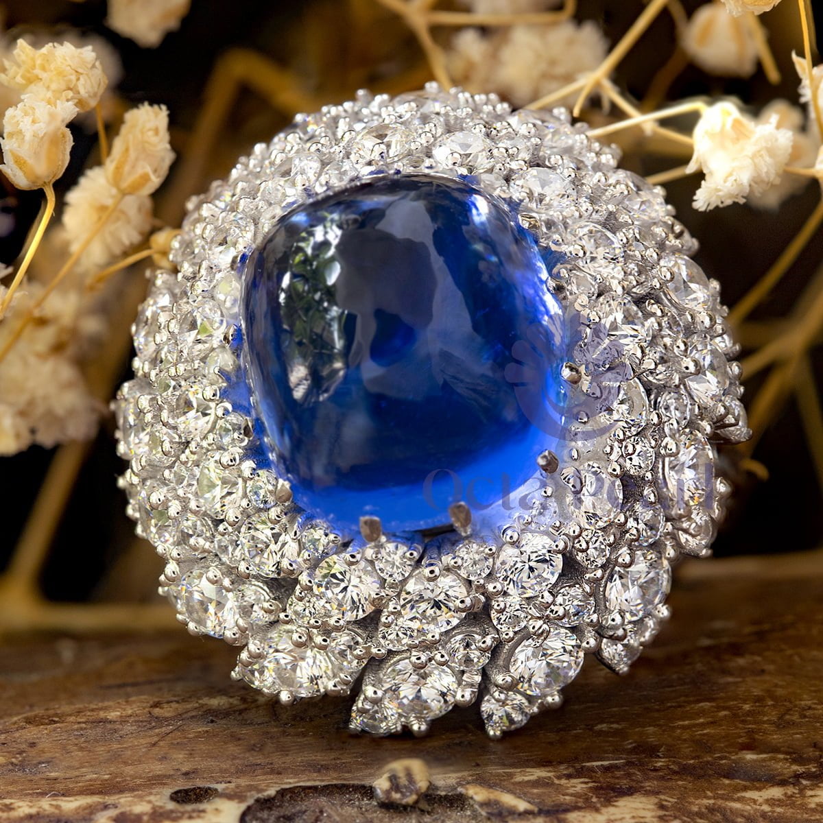 Blue Cabochon Cocktail Ring With CZ Halo