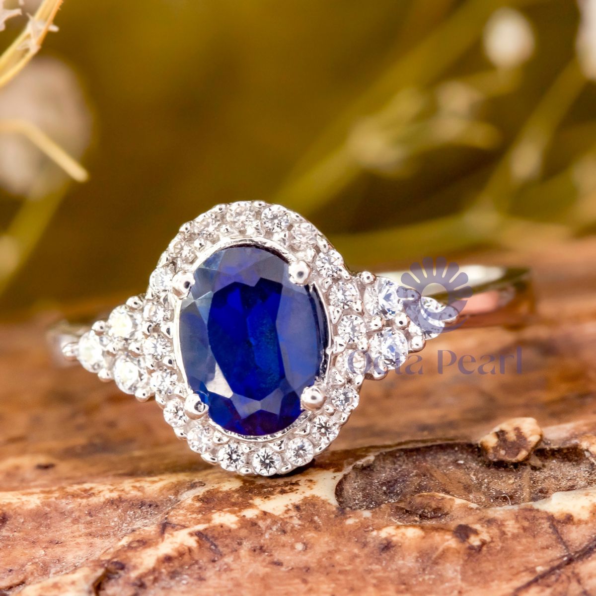 Blue Oval CZ Seven Stone Halo Engagement Ring